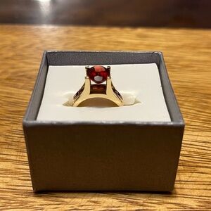 Elegant Gold Ring with Red Gemstone
